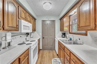 This home boasts a view like few others can perched high on a on Holiday Island Executive Golf Course in Arkansas - for sale on GolfHomes.com, golf home, golf lot