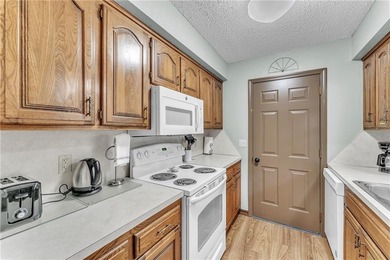 This home boasts a view like few others can perched high on a on Holiday Island Executive Golf Course in Arkansas - for sale on GolfHomes.com, golf home, golf lot