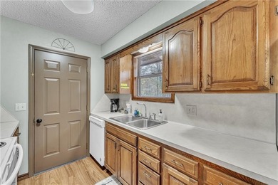 This home boasts a view like few others can perched high on a on Holiday Island Executive Golf Course in Arkansas - for sale on GolfHomes.com, golf home, golf lot