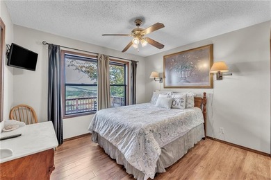 This home boasts a view like few others can perched high on a on Holiday Island Executive Golf Course in Arkansas - for sale on GolfHomes.com, golf home, golf lot