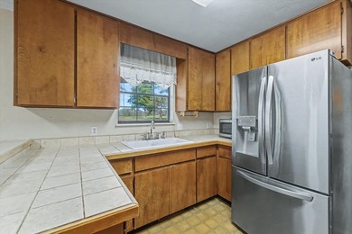 One or more photos has been virtually staged (office). Located on Killearn Country Club and Inn in Florida - for sale on GolfHomes.com, golf home, golf lot