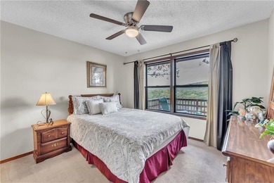 This home boasts a view like few others can perched high on a on Holiday Island Executive Golf Course in Arkansas - for sale on GolfHomes.com, golf home, golf lot