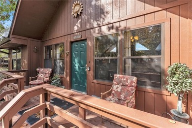 This home boasts a view like few others can perched high on a on Holiday Island Executive Golf Course in Arkansas - for sale on GolfHomes.com, golf home, golf lot