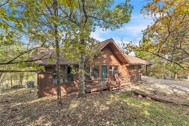 This home boasts a view like few others can perched high on a on Holiday Island Executive Golf Course in Arkansas - for sale on GolfHomes.com, golf home, golf lot