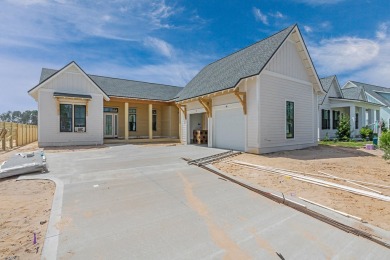 Discover refined coastal living in this stunning Hampton plan by on Origins Golf Club in Florida - for sale on GolfHomes.com, golf home, golf lot