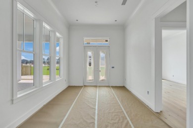 Discover refined coastal living in this stunning Hampton plan by on Origins Golf Club in Florida - for sale on GolfHomes.com, golf home, golf lot