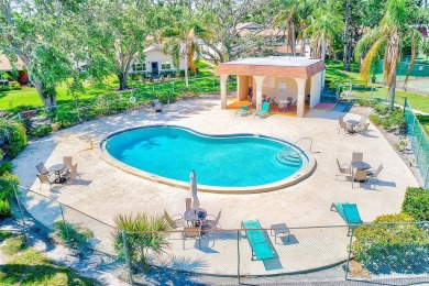 Welcome to this bright and inviting 2 bedroom, 1.5 bath, ground on Cove Cay Country Club in Florida - for sale on GolfHomes.com, golf home, golf lot