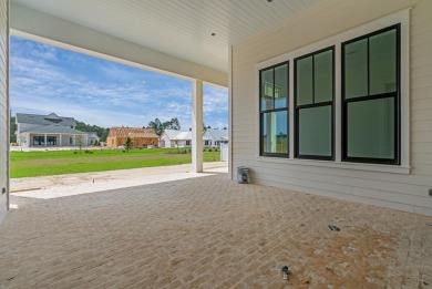 Discover refined coastal living in this stunning Hampton plan by on Origins Golf Club in Florida - for sale on GolfHomes.com, golf home, golf lot