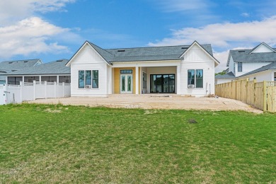 Discover refined coastal living in this stunning Hampton plan by on Origins Golf Club in Florida - for sale on GolfHomes.com, golf home, golf lot