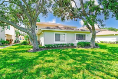Welcome to this bright and inviting 2 bedroom, 1.5 bath, ground on Cove Cay Country Club in Florida - for sale on GolfHomes.com, golf home, golf lot