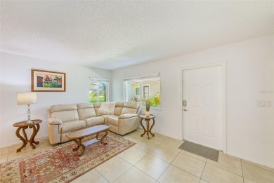 Welcome to this bright and inviting 2 bedroom, 1.5 bath, ground on Cove Cay Country Club in Florida - for sale on GolfHomes.com, golf home, golf lot