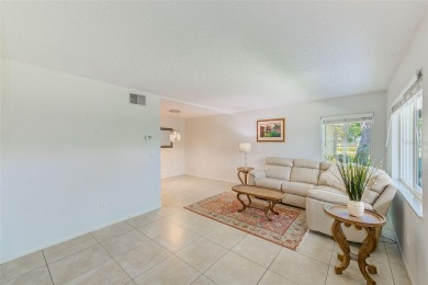 Welcome to this bright and inviting 2 bedroom, 1.5 bath, ground on Cove Cay Country Club in Florida - for sale on GolfHomes.com, golf home, golf lot