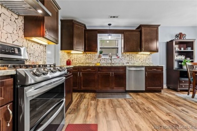 Welcome to your dream full-time residence in the heart of Four on Tan-Tar-A Golf Club in Missouri - for sale on GolfHomes.com, golf home, golf lot