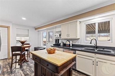 Welcome to 148 Glenhaven Drive, a spacious tri-level home in the on Lake Hills Golf Course in Montana - for sale on GolfHomes.com, golf home, golf lot