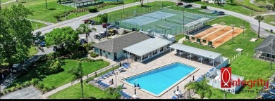 Come settle down and relax in a beautiful manufactured home with on Fairways Country Club in Florida - for sale on GolfHomes.com, golf home, golf lot