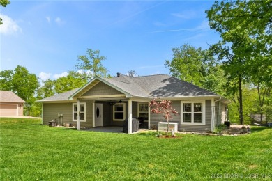 Welcome to your dream full-time residence in the heart of Four on Tan-Tar-A Golf Club in Missouri - for sale on GolfHomes.com, golf home, golf lot