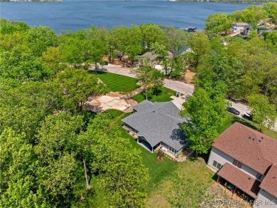 Welcome to your dream full-time residence in the heart of Four on Tan-Tar-A Golf Club in Missouri - for sale on GolfHomes.com, golf home, golf lot