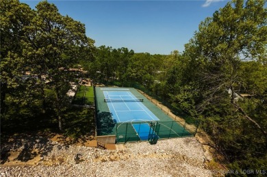 Welcome to your dream full-time residence in the heart of Four on Tan-Tar-A Golf Club in Missouri - for sale on GolfHomes.com, golf home, golf lot