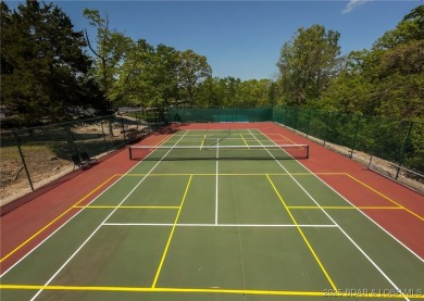 Welcome to your dream full-time residence in the heart of Four on Tan-Tar-A Golf Club in Missouri - for sale on GolfHomes.com, golf home, golf lot