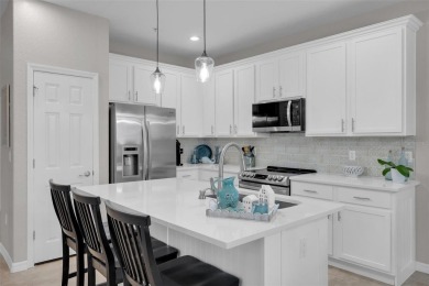 Welcome to this beautifully updated end-unit townhome, perfectly on Wedgefield Golf Club in Florida - for sale on GolfHomes.com, golf home, golf lot