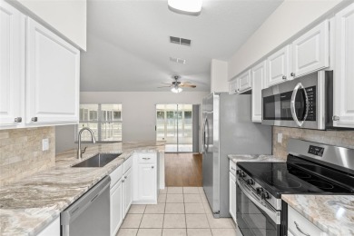 Perfect, completely updated 1,261square foot home sitting on the on Tampa Bay Golf and Country Club in Florida - for sale on GolfHomes.com, golf home, golf lot