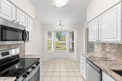 Perfect, completely updated 1,261square foot home sitting on the on Tampa Bay Golf and Country Club in Florida - for sale on GolfHomes.com, golf home, golf lot