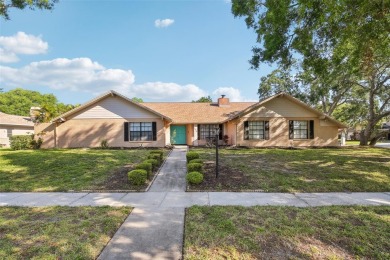 Welcome to this Beautiful Corner-Lot Ranch-Style Pool Home in on East Lake Woodlands Country Club in Florida - for sale on GolfHomes.com, golf home, golf lot