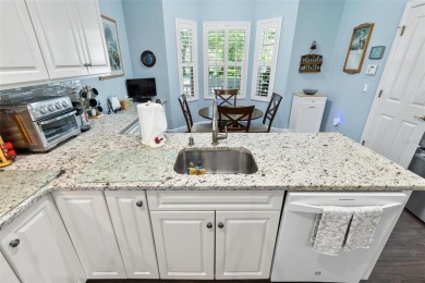 This charming home is located on a quaint street in the gated on Grand Haven Golf Club in Florida - for sale on GolfHomes.com, golf home, golf lot