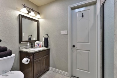 Discover luxury living in this exquisite 4-bedroom, 4-bathroom on Abilene Country Club - South Course in Texas - for sale on GolfHomes.com, golf home, golf lot