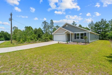 Tucked into a peaceful, wooded setting with no neighbors to the on Sunny Hills Golf and Country Club in Florida - for sale on GolfHomes.com, golf home, golf lot