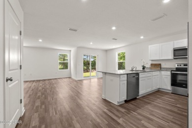 Tucked into a peaceful, wooded setting with no neighbors to the on Sunny Hills Golf and Country Club in Florida - for sale on GolfHomes.com, golf home, golf lot