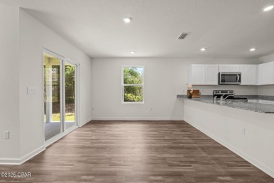 Tucked into a peaceful, wooded setting with no neighbors to the on Sunny Hills Golf and Country Club in Florida - for sale on GolfHomes.com, golf home, golf lot