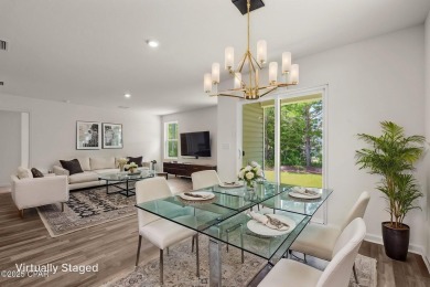 Tucked into a peaceful, wooded setting with no neighbors to the on Sunny Hills Golf and Country Club in Florida - for sale on GolfHomes.com, golf home, golf lot