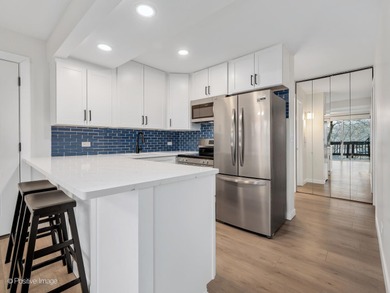 Freshly renovated second-floor lakefront unit offering the on River Bend Golf Club in Illinois - for sale on GolfHomes.com, golf home, golf lot