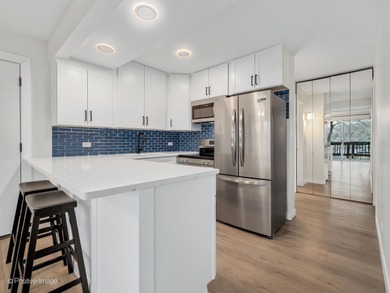 Freshly renovated second-floor lakefront unit offering the on River Bend Golf Club in Illinois - for sale on GolfHomes.com, golf home, golf lot