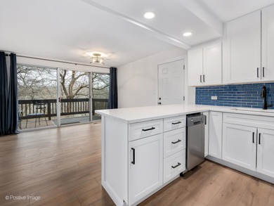 Freshly renovated second-floor lakefront unit offering the on River Bend Golf Club in Illinois - for sale on GolfHomes.com, golf home, golf lot