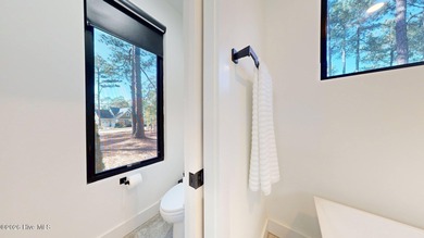 Experience the ultimate in Contemporary Living. This on Forest Creek Golf Club  in North Carolina - for sale on GolfHomes.com, golf home, golf lot