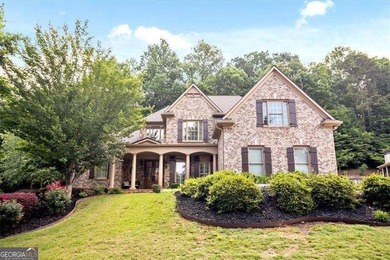Discover timeless elegance and modern comfort in this on Woodmont Golf and Country Club in Georgia - for sale on GolfHomes.com, golf home, golf lot