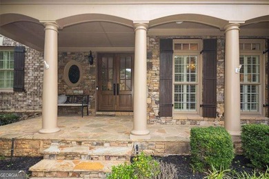 Discover timeless elegance and modern comfort in this on Woodmont Golf and Country Club in Georgia - for sale on GolfHomes.com, golf home, golf lot