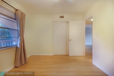 A breathtaking view and a peaceful living environment where life on Wynmoor Golf Course in Florida - for sale on GolfHomes.com, golf home, golf lot