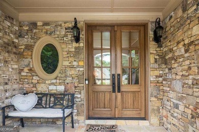 Discover timeless elegance and modern comfort in this on Woodmont Golf and Country Club in Georgia - for sale on GolfHomes.com, golf home, golf lot