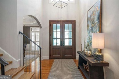 Discover timeless elegance and modern comfort in this on Woodmont Golf and Country Club in Georgia - for sale on GolfHomes.com, golf home, golf lot