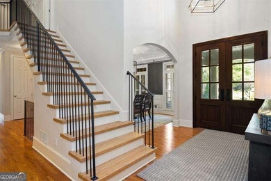 Discover timeless elegance and modern comfort in this on Woodmont Golf and Country Club in Georgia - for sale on GolfHomes.com, golf home, golf lot