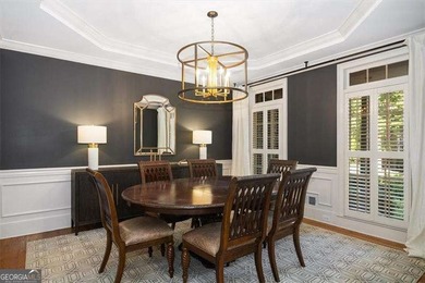 Discover timeless elegance and modern comfort in this on Woodmont Golf and Country Club in Georgia - for sale on GolfHomes.com, golf home, golf lot