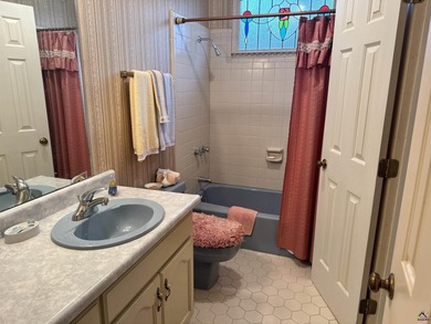 Rare opportunity to live on the 9th fairway of the Country Club on Canongate At Healy Point Country Club in Georgia - for sale on GolfHomes.com, golf home, golf lot