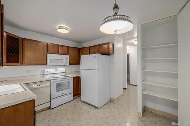 Step into this move in ready ground level condo in the heart of on Emerald Greens Golf Club in Colorado - for sale on GolfHomes.com, golf home, golf lot