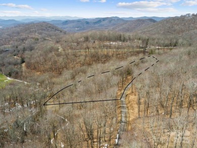 Nestled in woods of the Blue Ridge Mountains, behind protected on Wolf Laurel Country Club in North Carolina - for sale on GolfHomes.com, golf home, golf lot