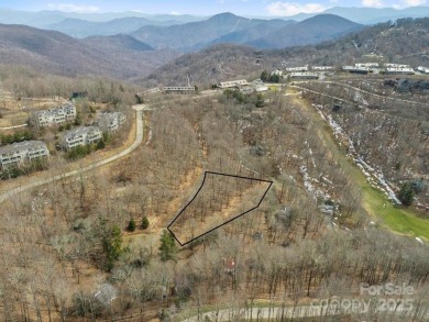 Nestled in woods of the Blue Ridge Mountains, behind protected on Wolf Laurel Country Club in North Carolina - for sale on GolfHomes.com, golf home, golf lot