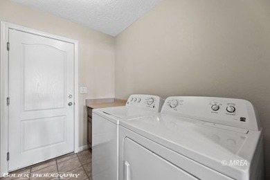 This gorgeous townhome sits right off the golf course and has on The Oasis Golf Club in Nevada - for sale on GolfHomes.com, golf home, golf lot