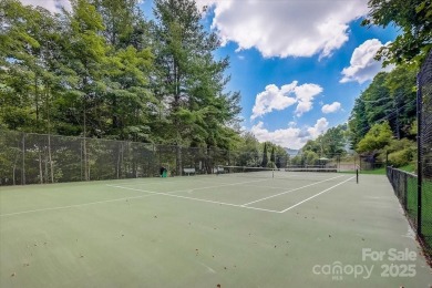 Nestled in woods of the Blue Ridge Mountains, behind protected on Wolf Laurel Country Club in North Carolina - for sale on GolfHomes.com, golf home, golf lot